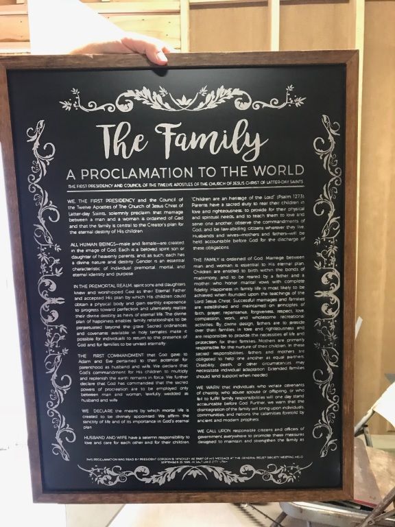 Wooden framed engraving with text