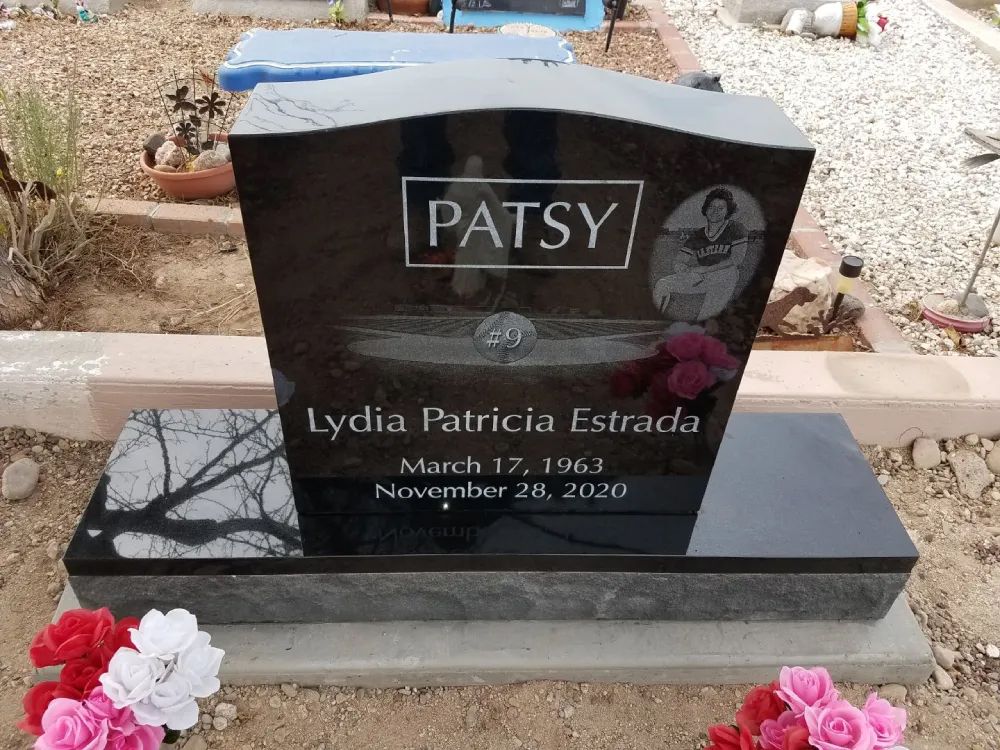 black headstone with football engraving
