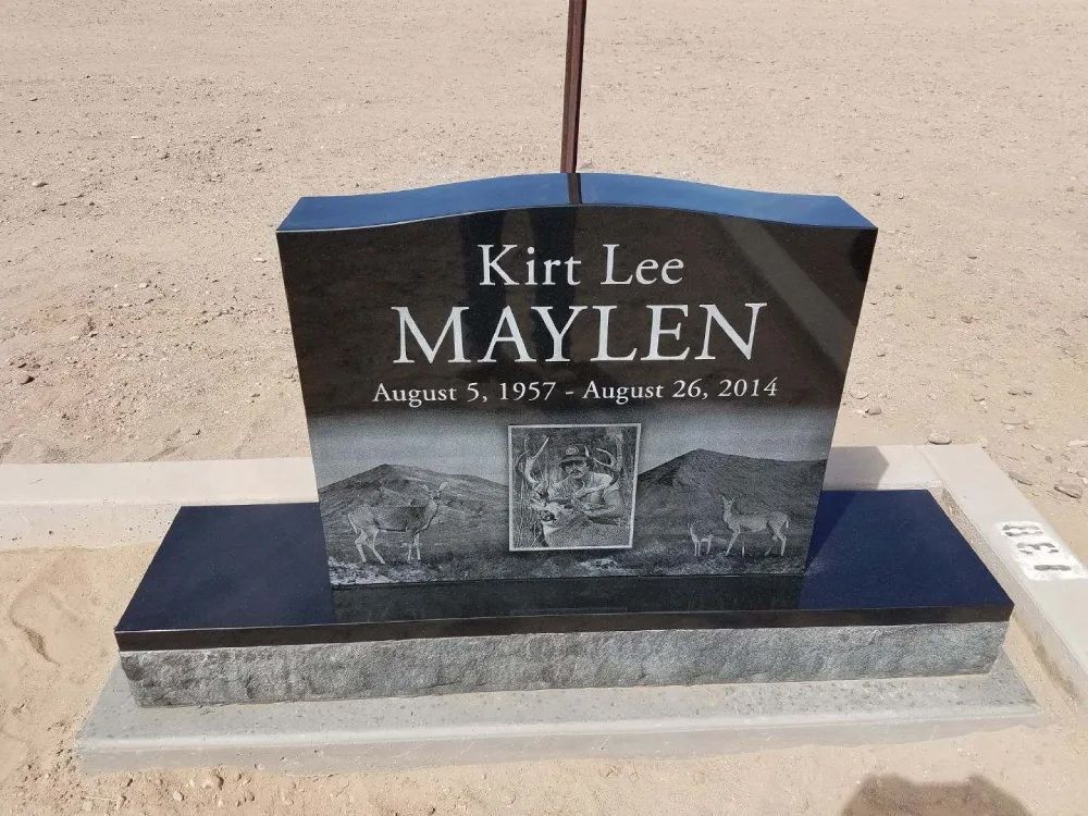 black headstone with hunting engraving