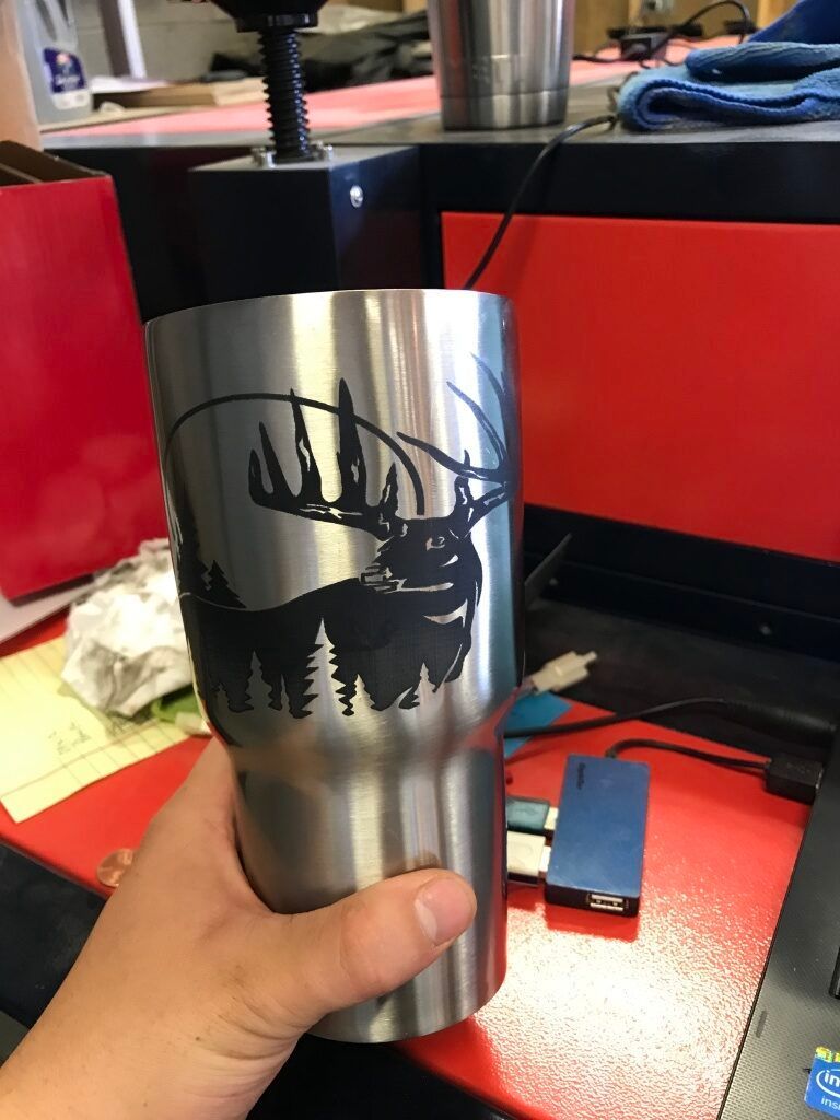 buck engraving on metal cup