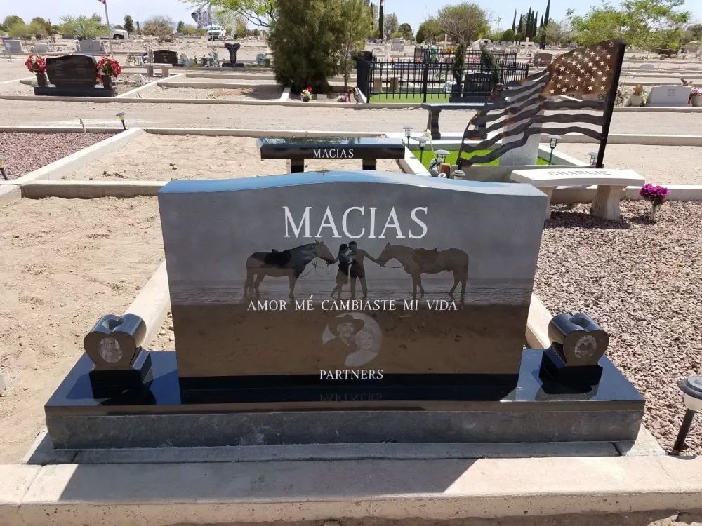 headstone with couple and their horses