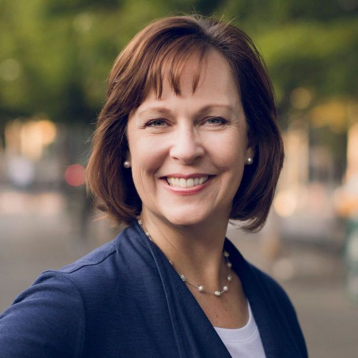 Headshot of Kirsten C. Meneghello.