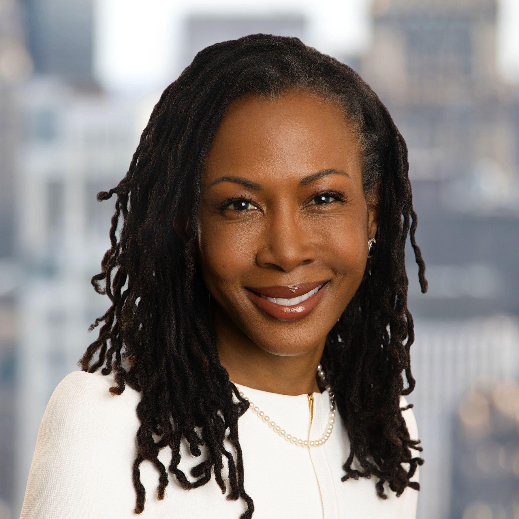 Headshot of Ghillaine Reid.