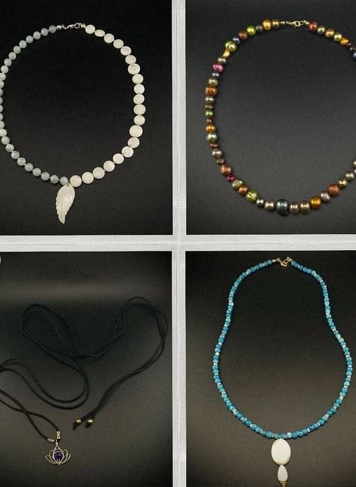 Four beaded necklaces.