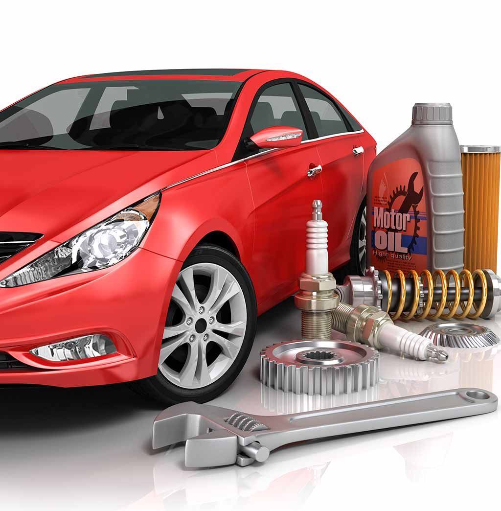 A red car is surrounded by a variety of car parts.