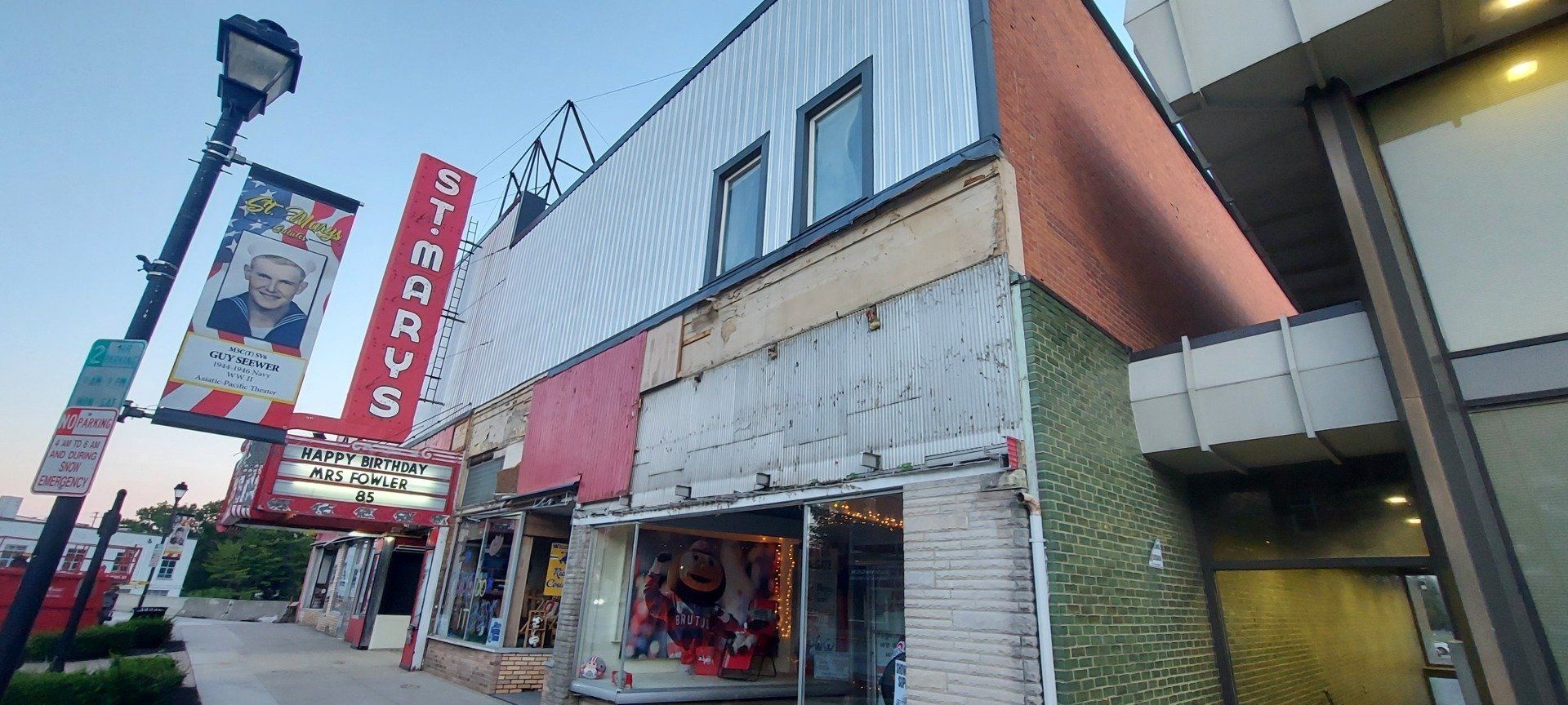 A building with a sign that says mr. cross on it