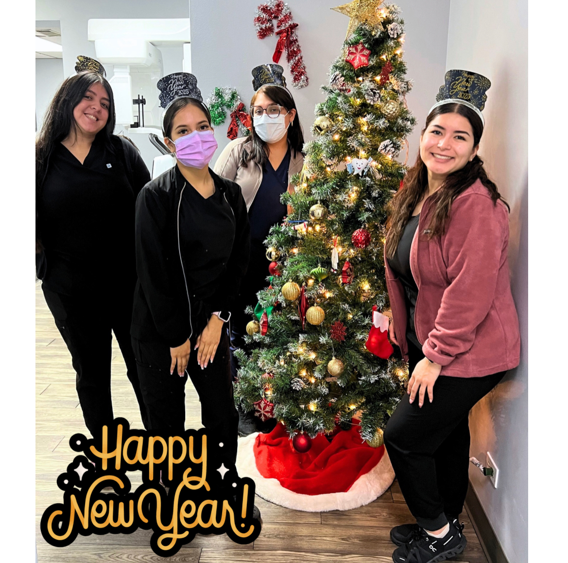 staff smiling Christmas tree