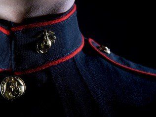 A close up of a man wearing a marine corps uniform