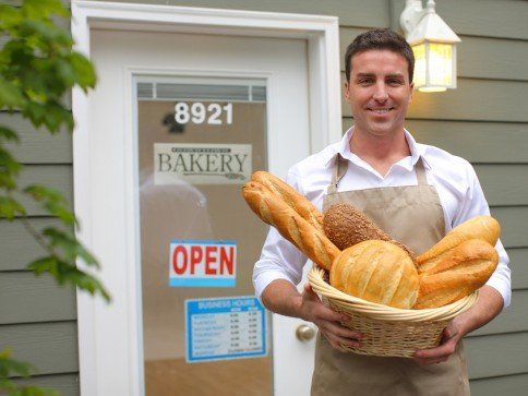 Bakery-owner-in-front-of-shop