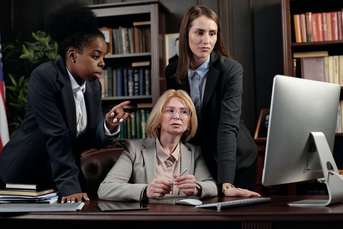 female-lawyers-in-an-office-looking-at-a-computer