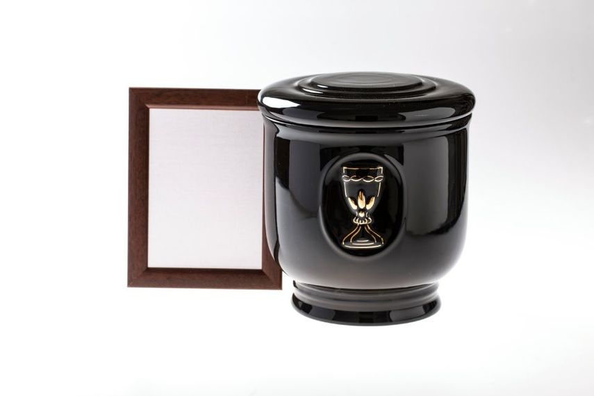 black cinerary urn and frame