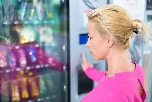 Woman looking at Vending Machine — Vending in Berrimah, NT