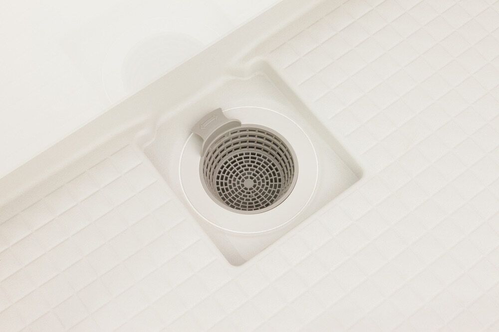 A Close Up Of A Drain In A Bathroom — Gordo's Plumbing Service In Wagga Wagga, NSW