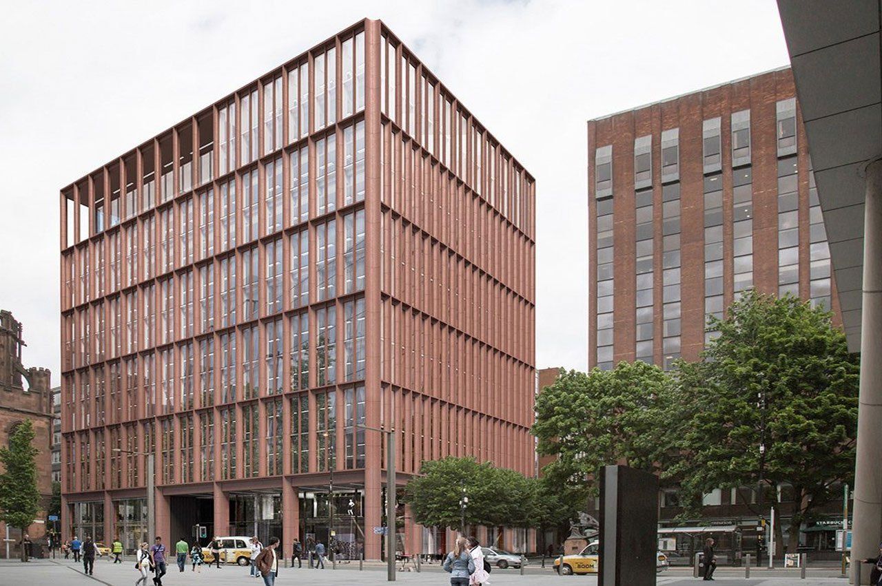 Large commercial office building, made of what looks like rusted metal with lots of glass windows. In front a sparse crowd of people walk about. 