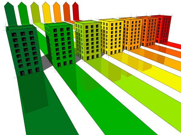 An illustration of high-rise buildings coloured from green to red