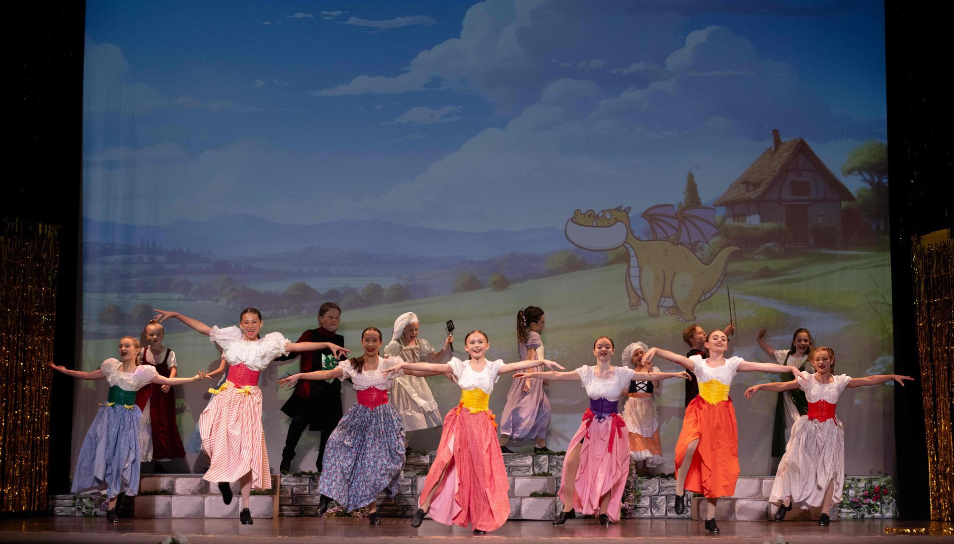 Group of children performing during a theater performance at Moss Performing Arts Academy