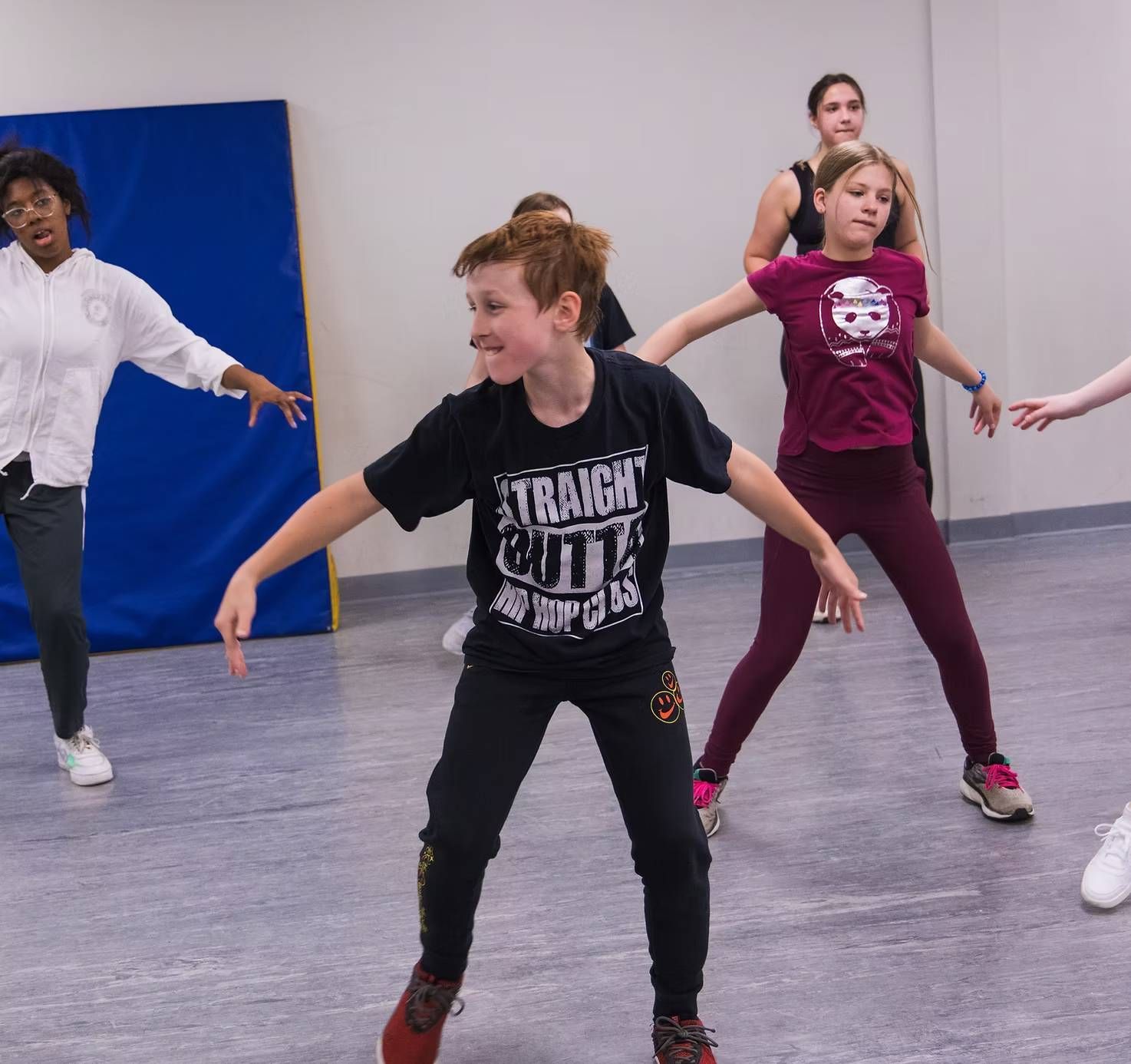 A group of children participating in a dance class at Moss Performing Arts Academy