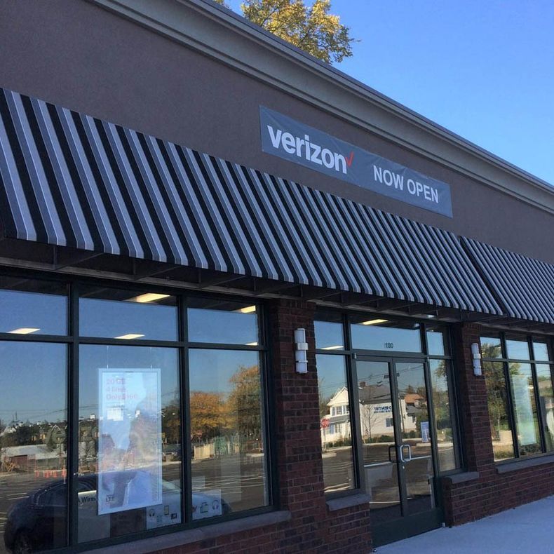 A verizon store is now open with a striped awning - Freehold, NJ - Awning Design Inc
