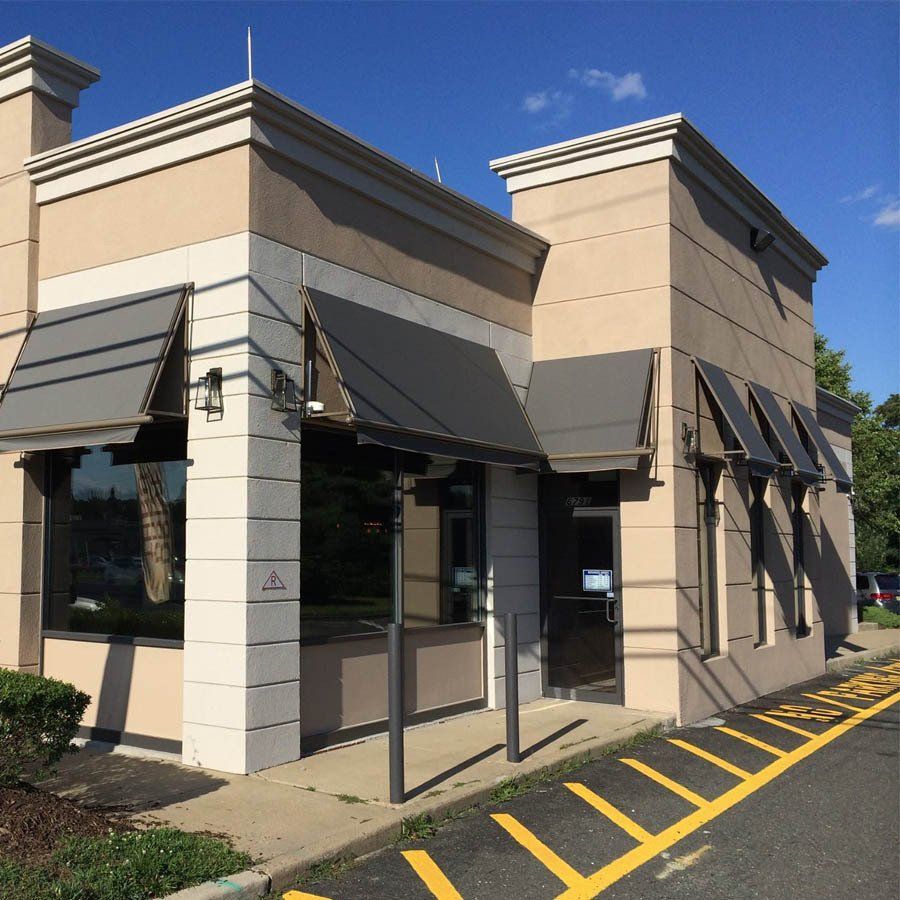 A building with a parking lot in front of it