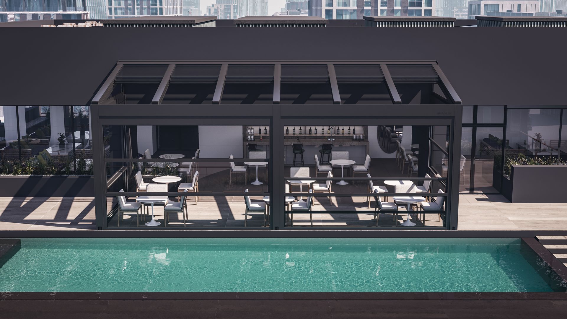 An aerial view of a building with a swimming pool and a pergola - Freehold, NJ - Awning Design Inc