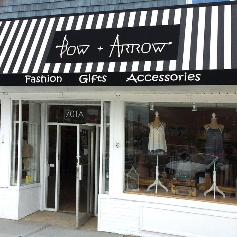The front of a store called pow + arrow - Freehold, NJ - Awning Design Inc