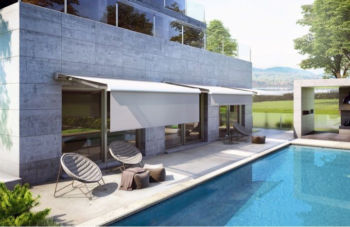 A house with a swimming pool in front of it - Freehold, NJ - Awning Design Inc