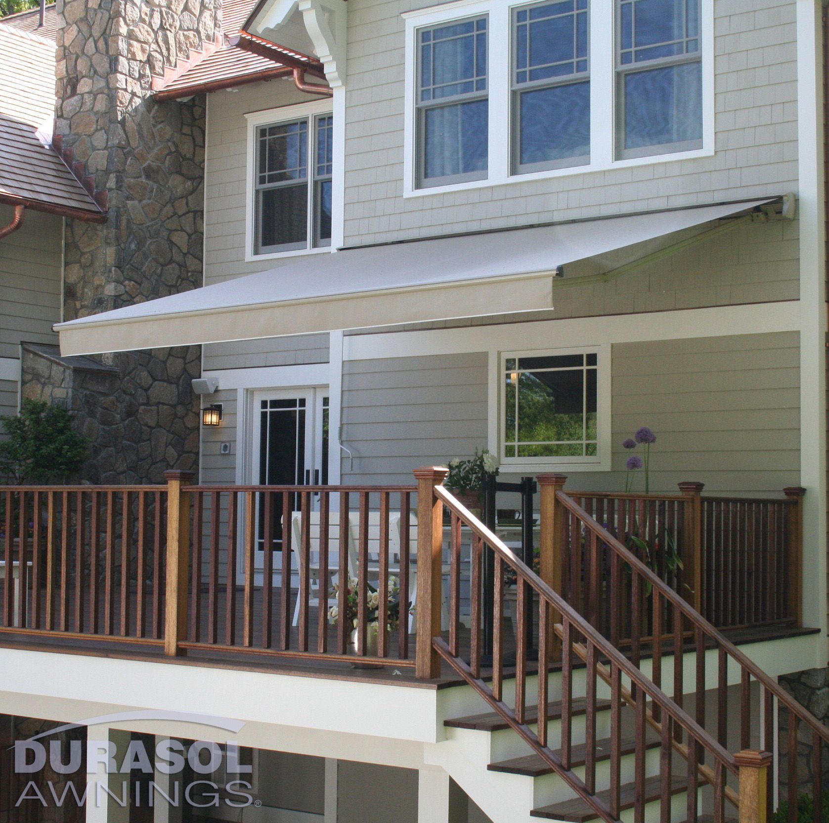 A house with a durasol awning on the porch - Freehold, NJ - Awning Design Inc