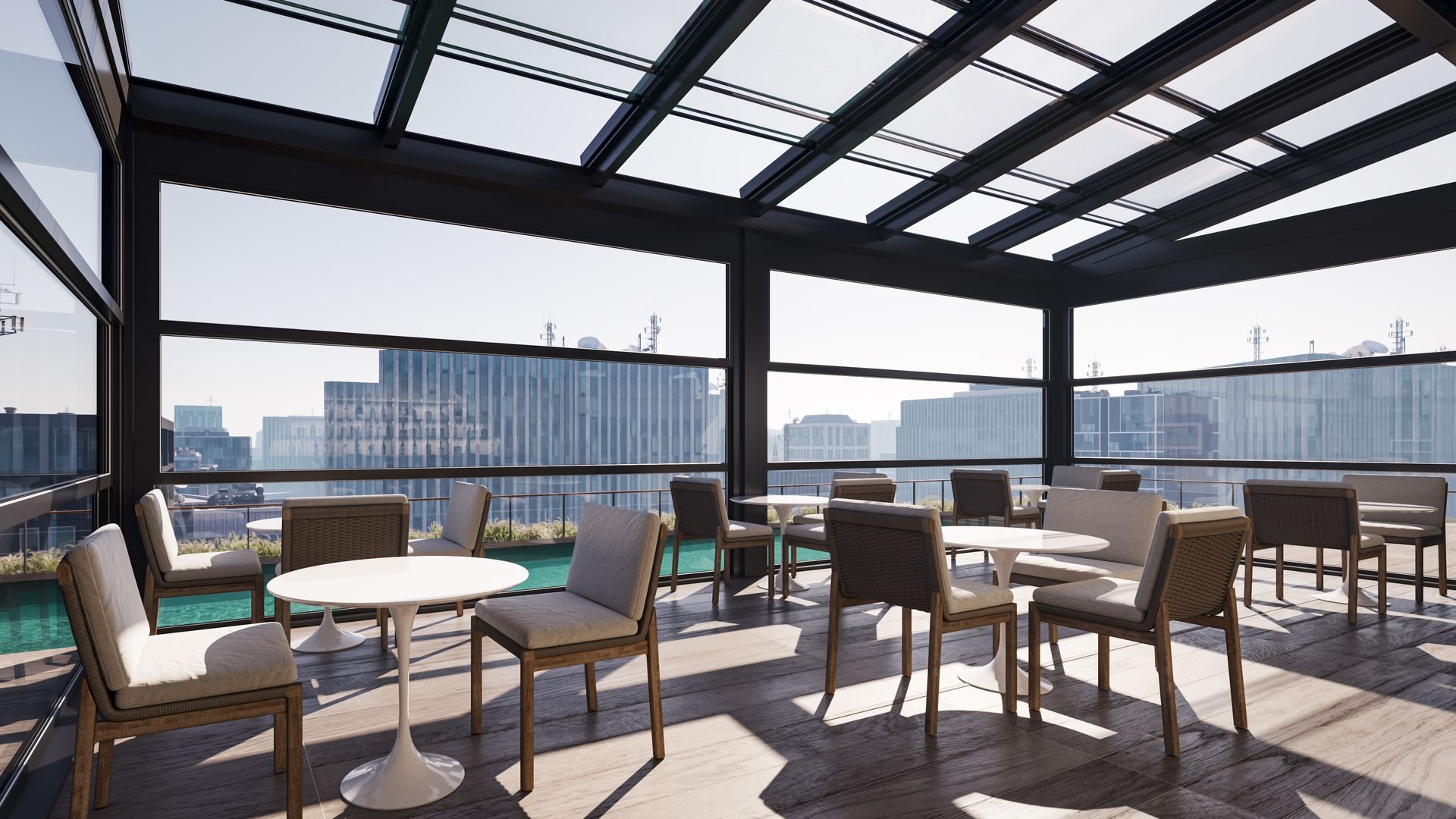 A rooftop patio with tables and chairs and a view of the city - Freehold, NJ - Awning Design Inc