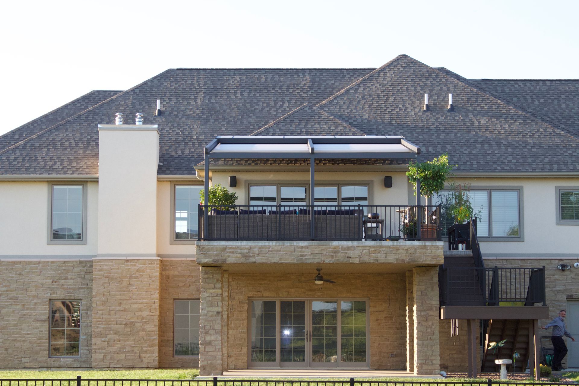 A large house with a balcony and stairs - Freehold, NJ - Awning Design Inc