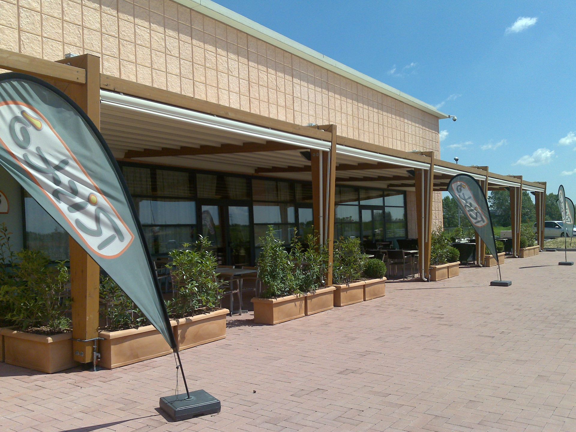 A large building with a sign - Freehold, NJ - Awning Design Inc