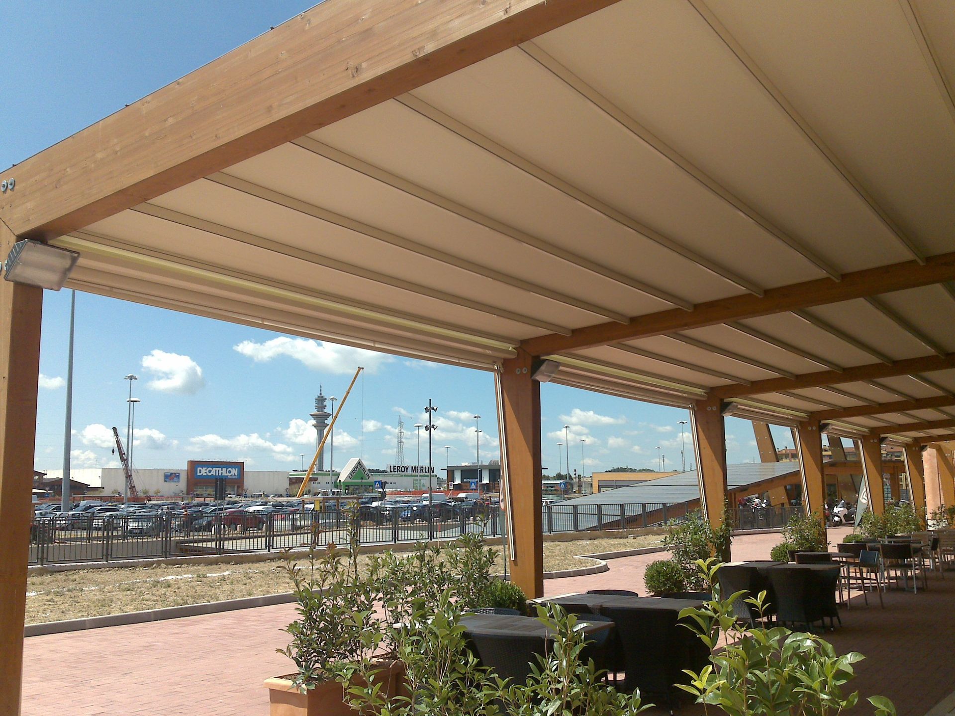 A covered area with tables and chairs under a canopy - Freehold, NJ - Awning Design Inc