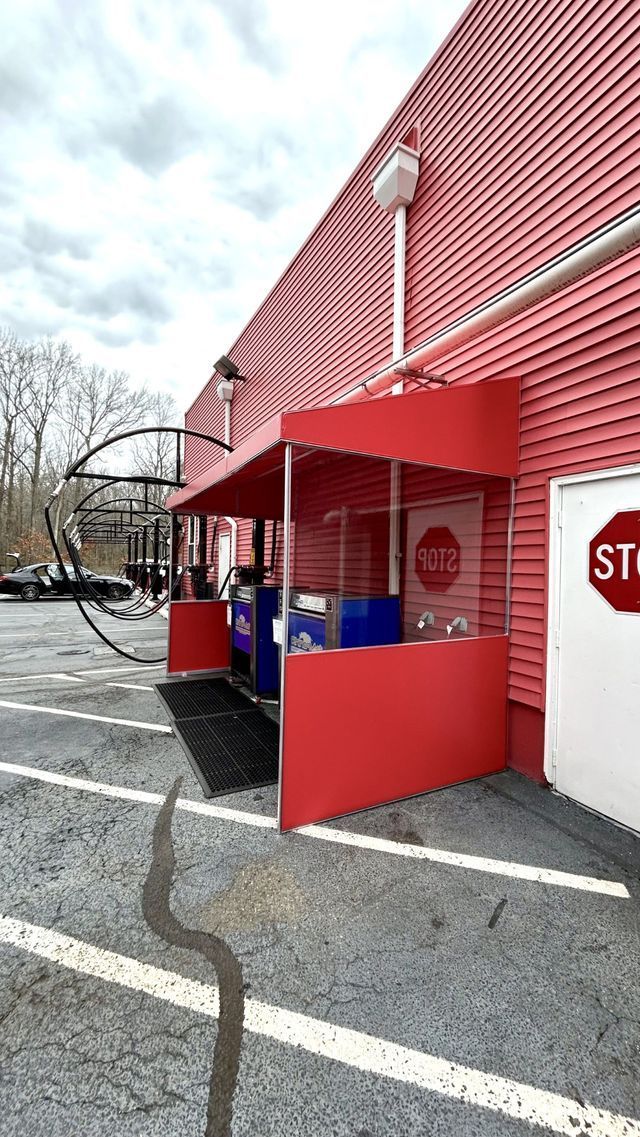 A red building with a stop sign on the side of it - Freehold, NJ - Awning Design Inc