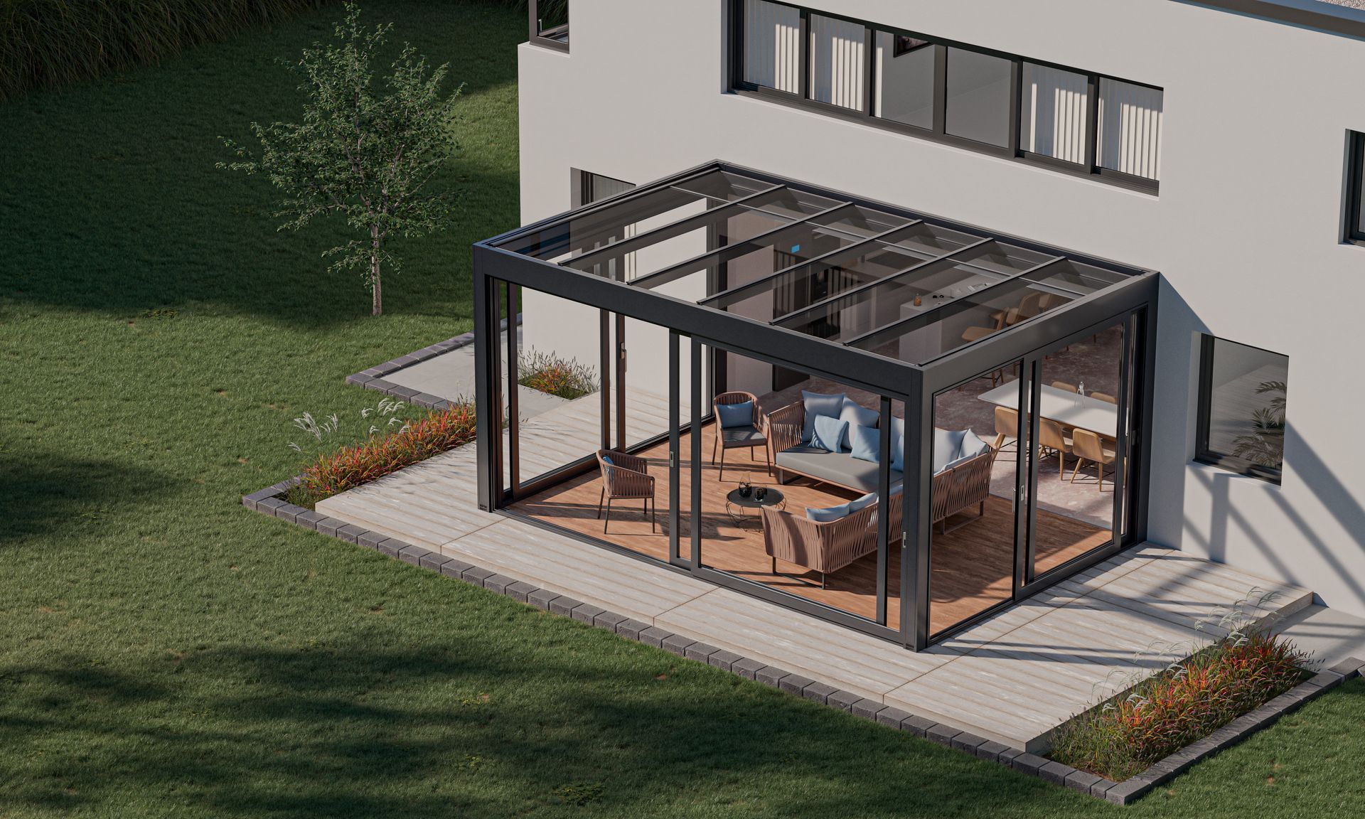 An aerial view of a house with a large glass room - Freehold, NJ - Awning Design Inc