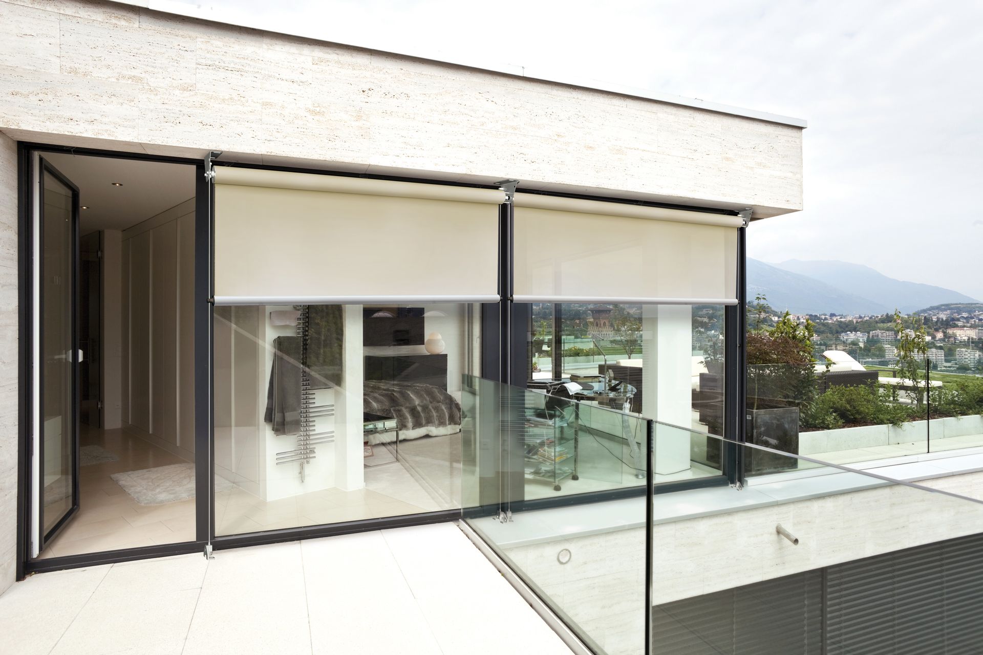 A balcony with a view of a bedroom and mountains - Freehold, NJ - Awning Design Inc