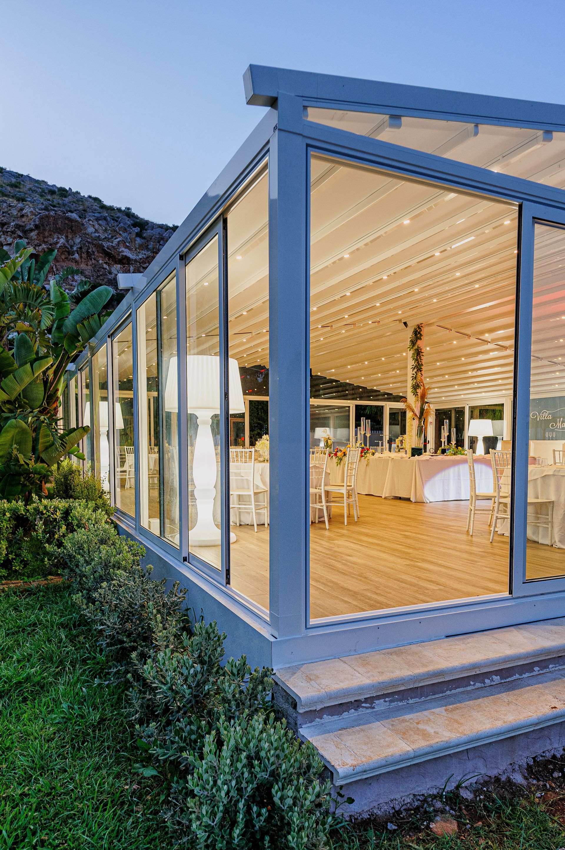 A large glass building with stairs leading up to it - Freehold, NJ - Awning Design Inc