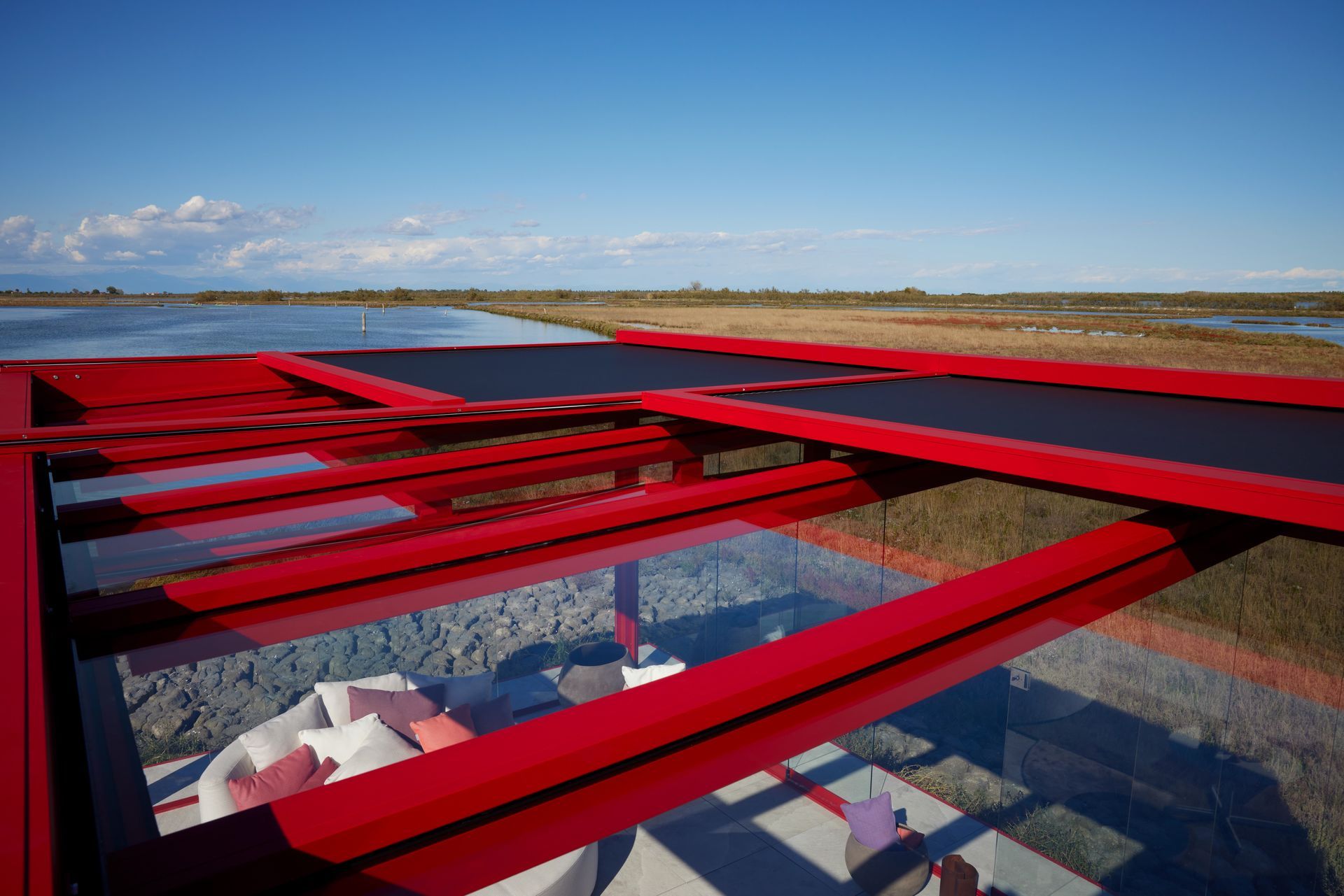 A red bridge with a view of a body of water - Freehold, NJ - Awning Design Inc