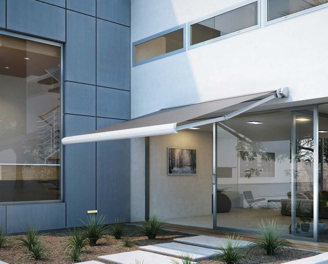 A building with a gray awning on the side of it - Freehold, NJ - Awning Design Inc