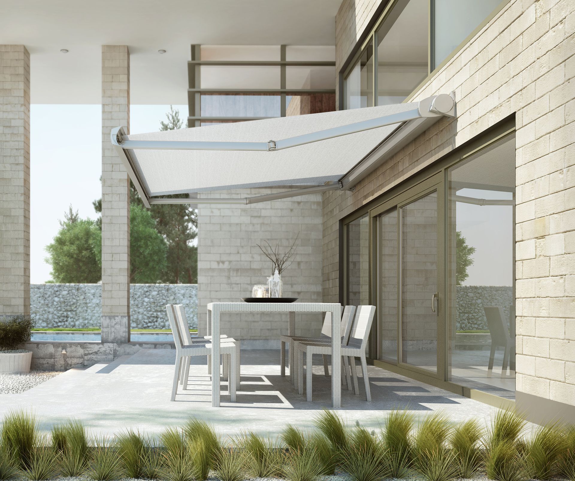 A patio with a table and chairs under an awning - Freehold, NJ - Awning Design Inc