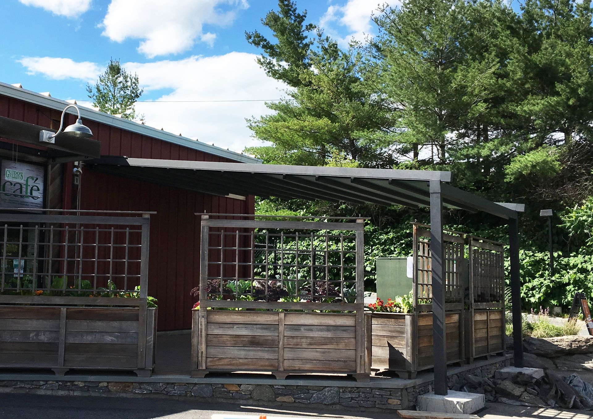 A red building with a sign that says cafe on it - Freehold, NJ - Awning Design Inc
