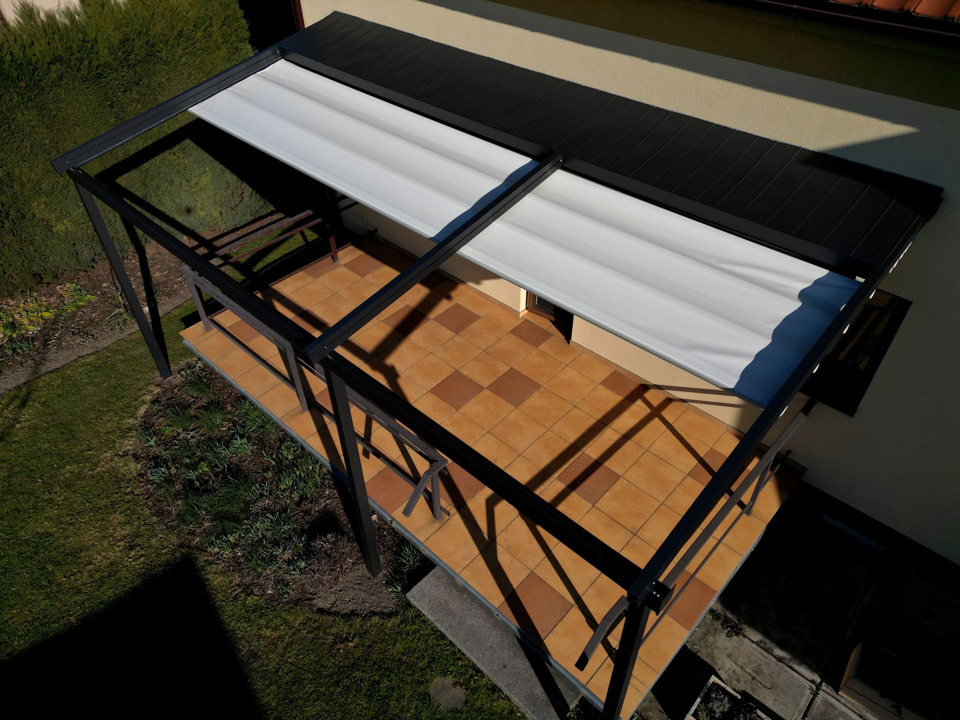 Retractable awning protecting space from the sunlight Retractable awning protecting space from the sunlight