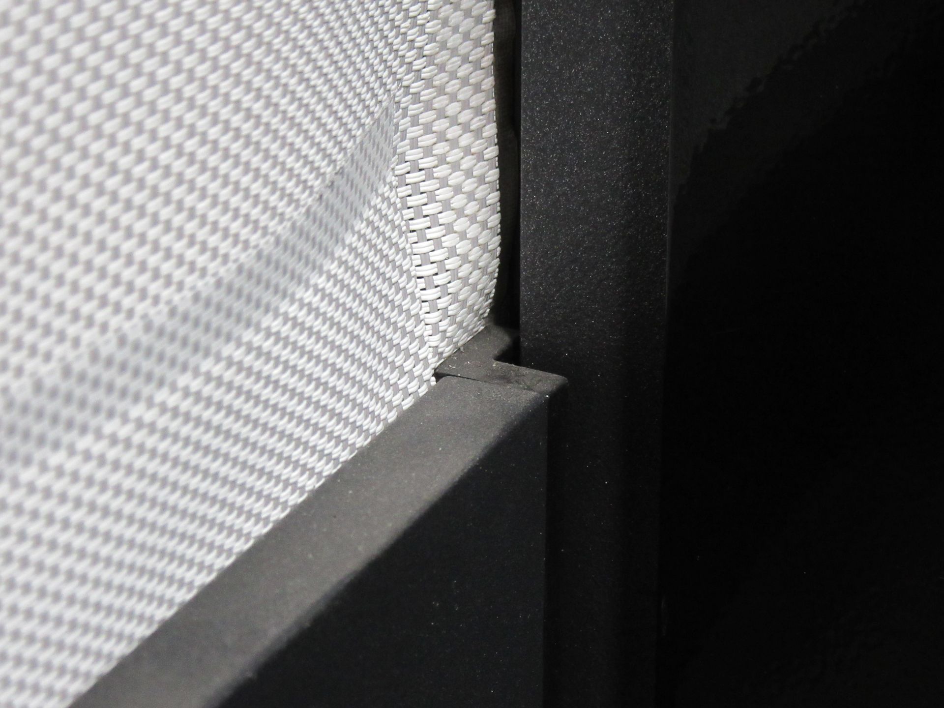 A close up of a mattress on a bed with a black frame - Freehold, NJ - Awning Design Inc