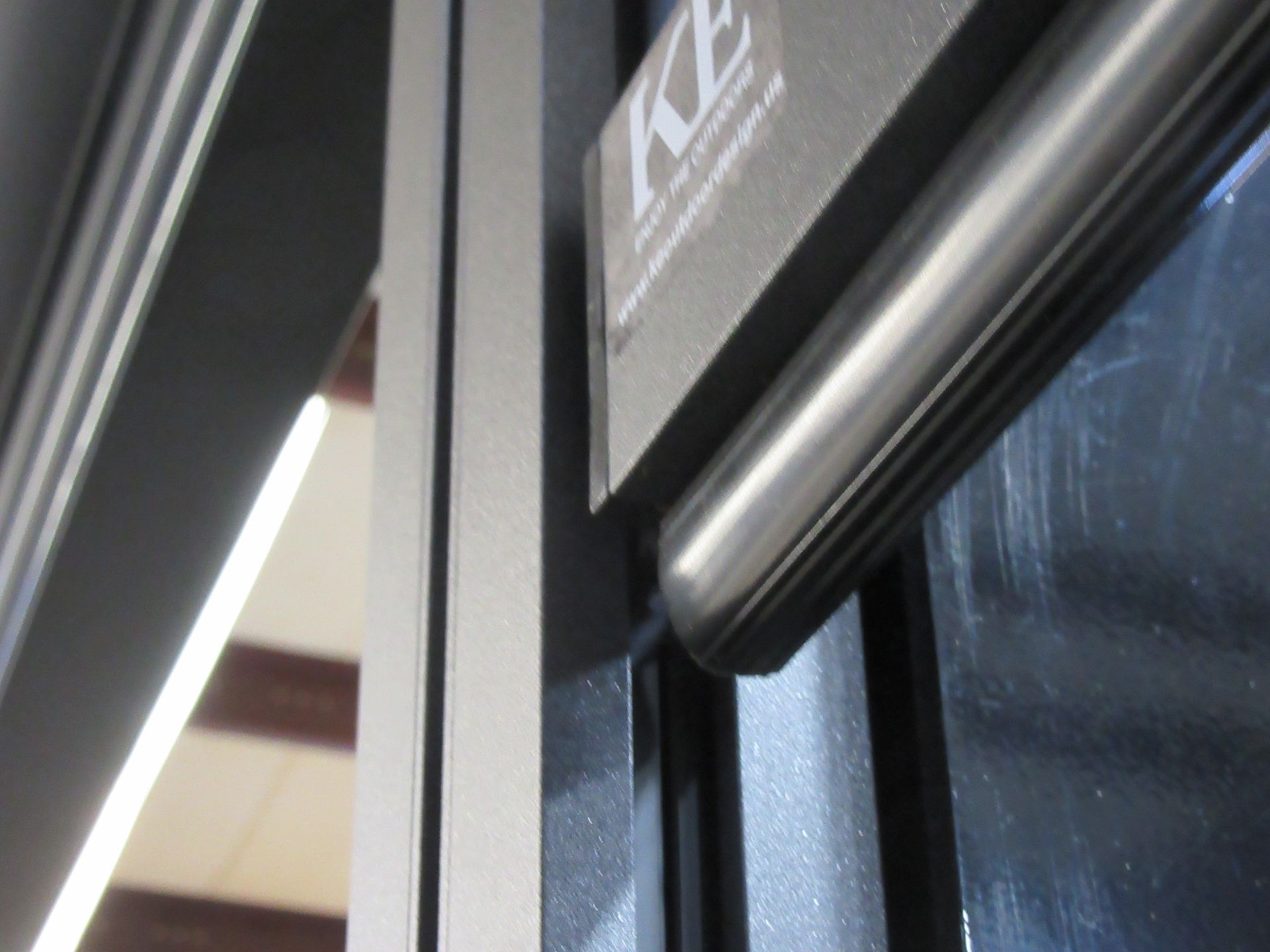 A sign on a door that says kz on it - Freehold, NJ - Awning Design Inc