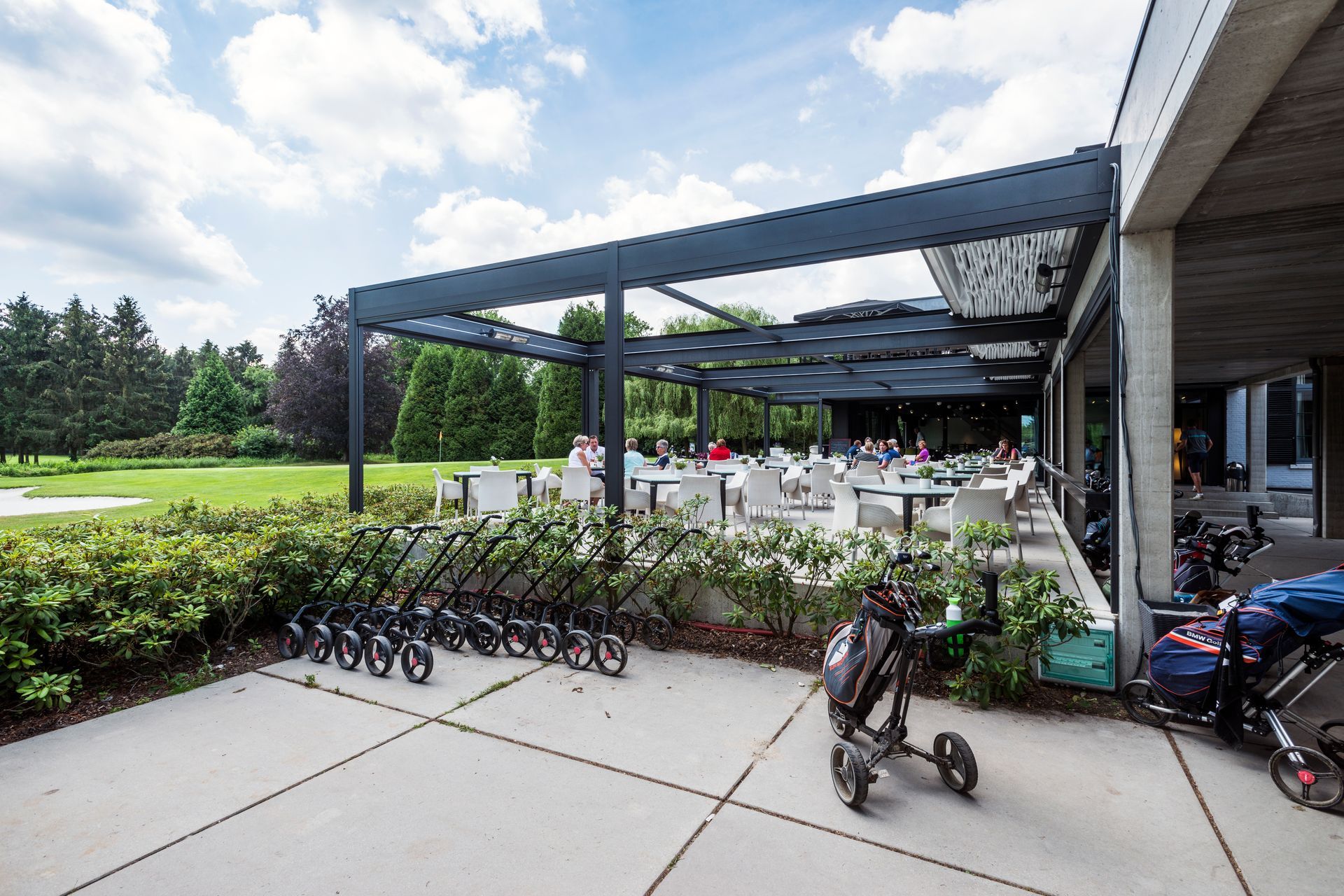 A golf cart is parked on the sidewalk in front of a restaurant - Freehold, NJ - Awning Design Inc