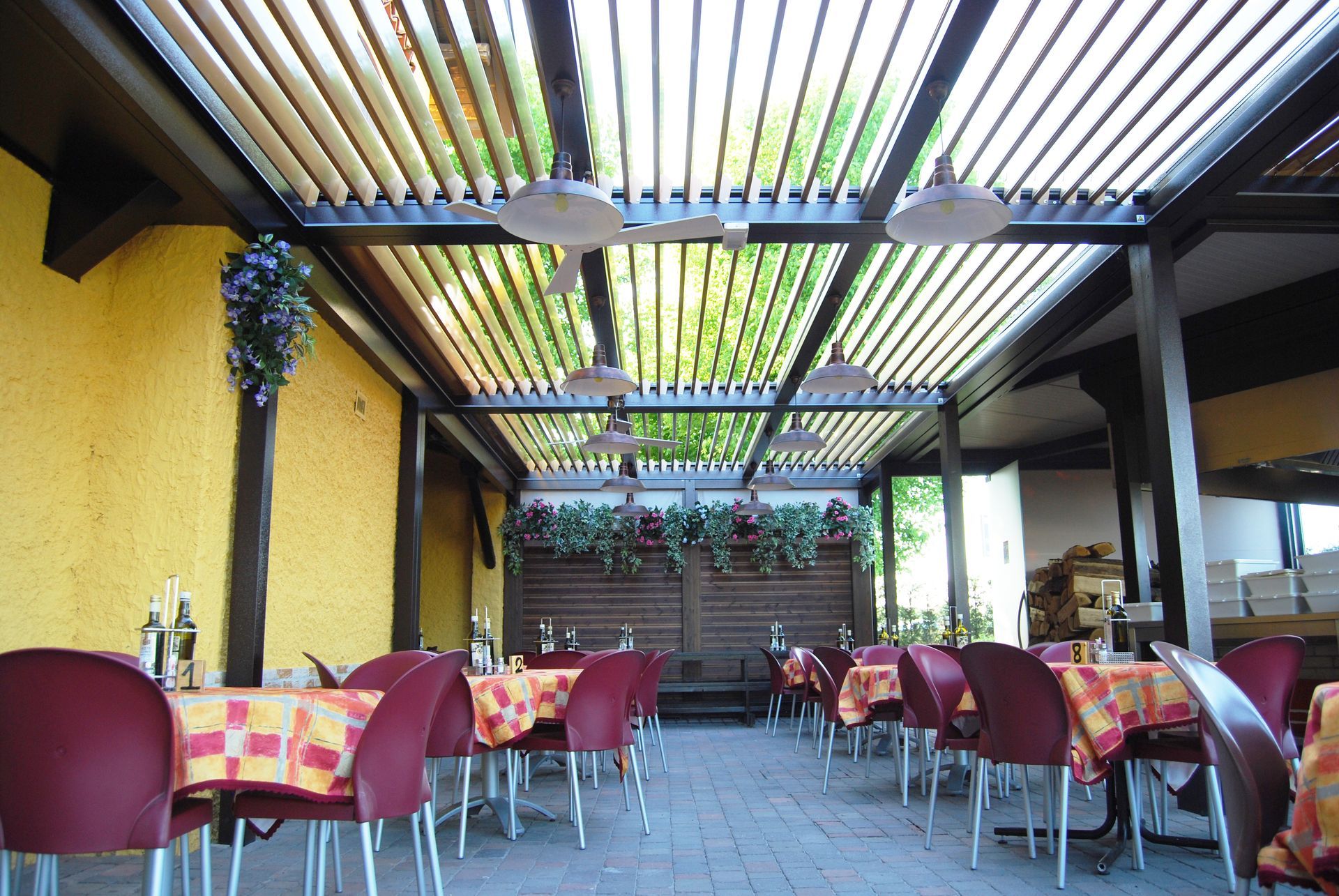 A restaurant with tables and chairs under a canopy - Freehold, NJ - Awning Design Inc