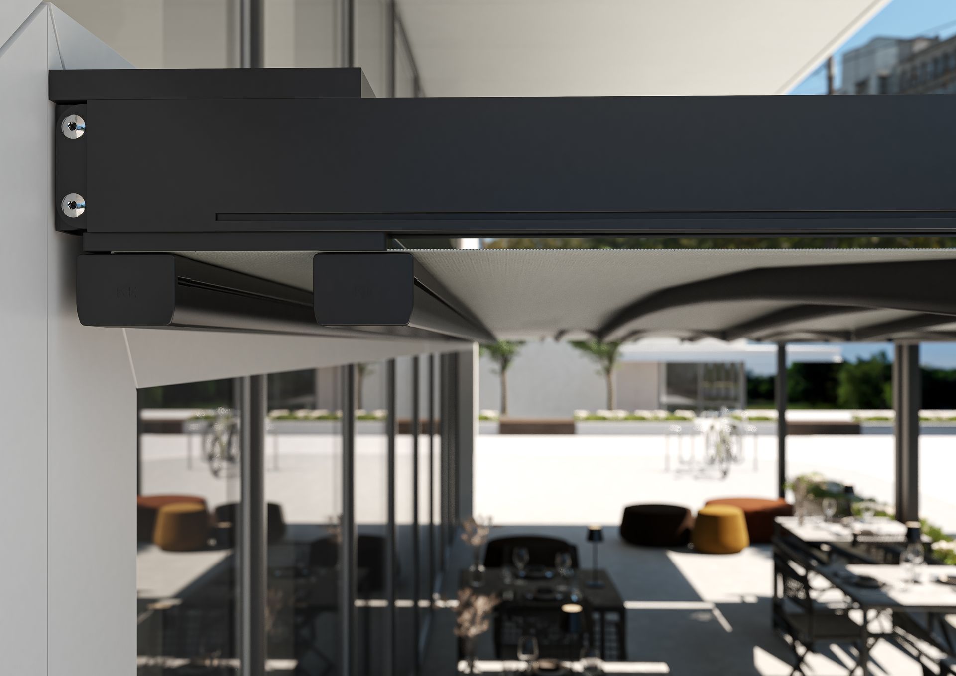 A patio with tables and chairs and a black awning - Freehold, NJ - Awning Design Inc