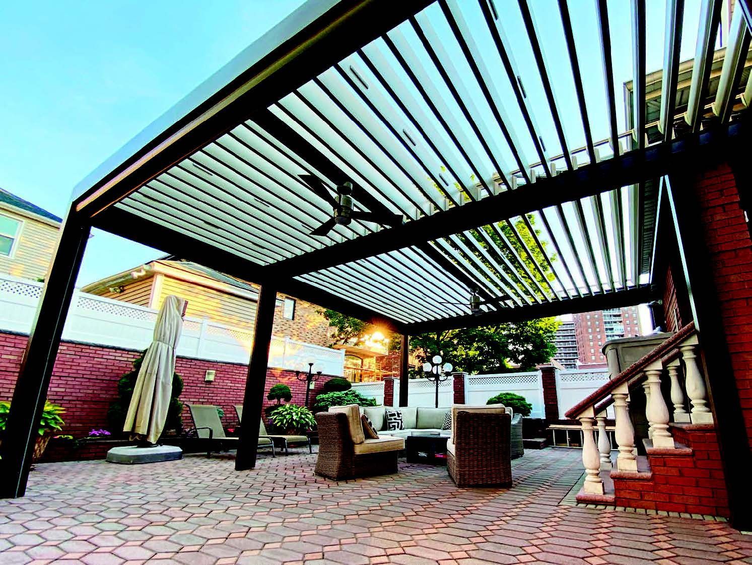 A patio with a pergola and a ceiling fan - Freehold, NJ - Awning Design Inc