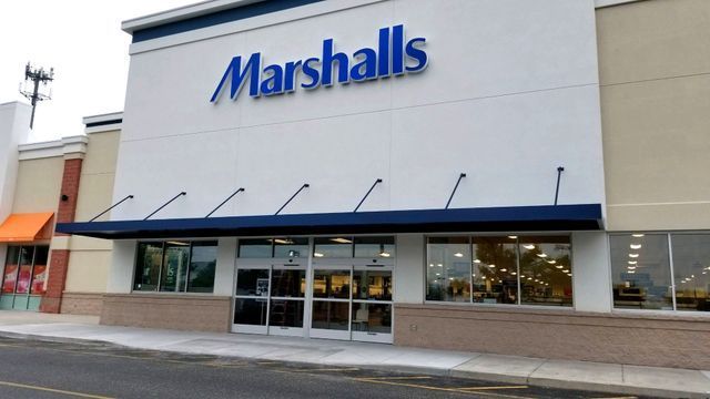 The front of a marshalls store with a blue awning - Freehold, NJ - Awning Design Inc