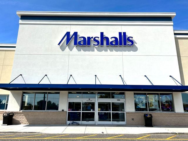 The front of a marshalls store with a blue awning - Freehold, NJ - Awning Design Inc