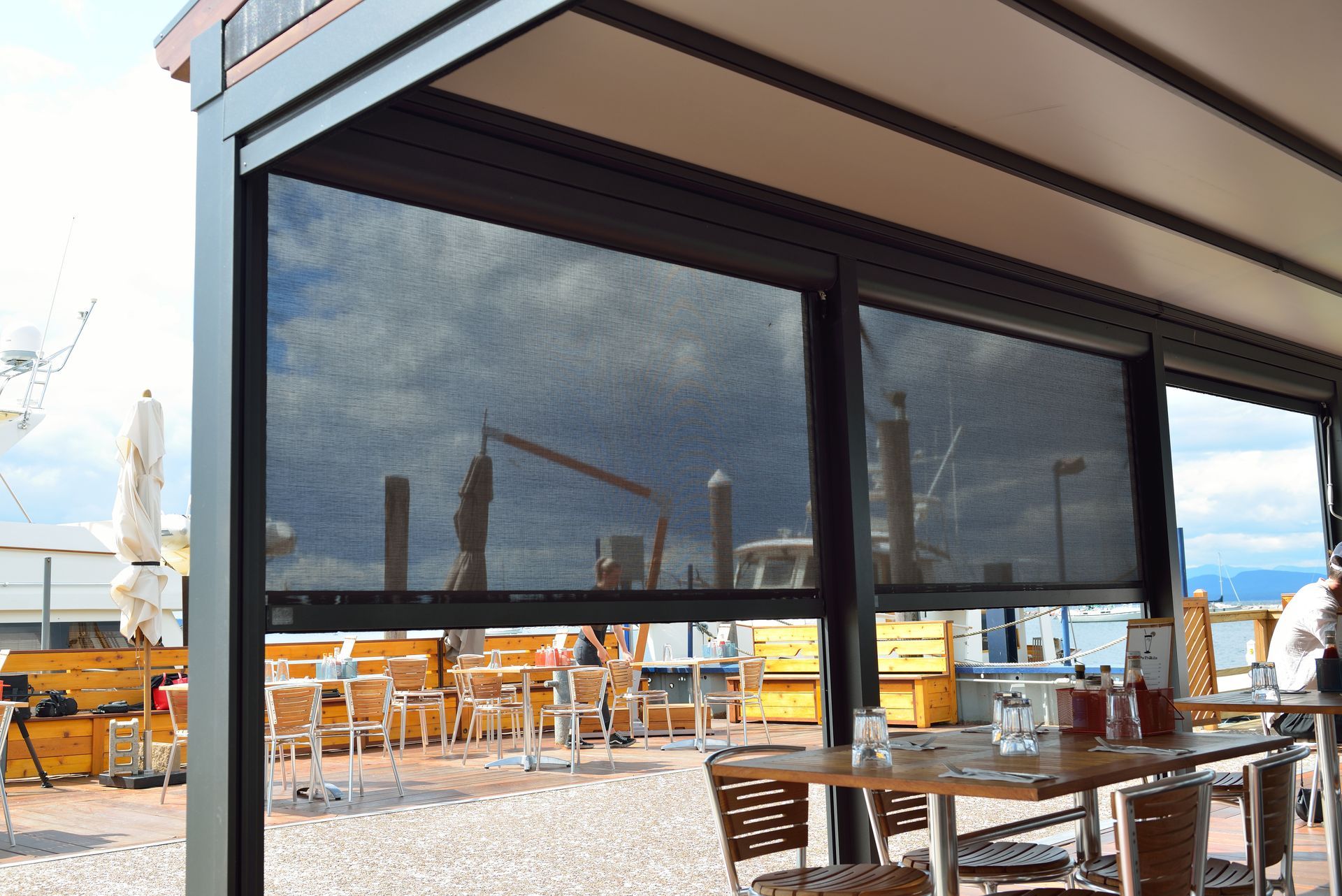 A restaurant with tables and chairs under a canopy - Freehold, NJ - Awning Design Inc