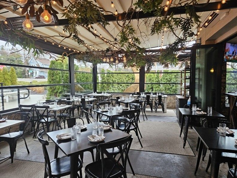 A restaurant with tables and chairs A restaurant with tables and chairs